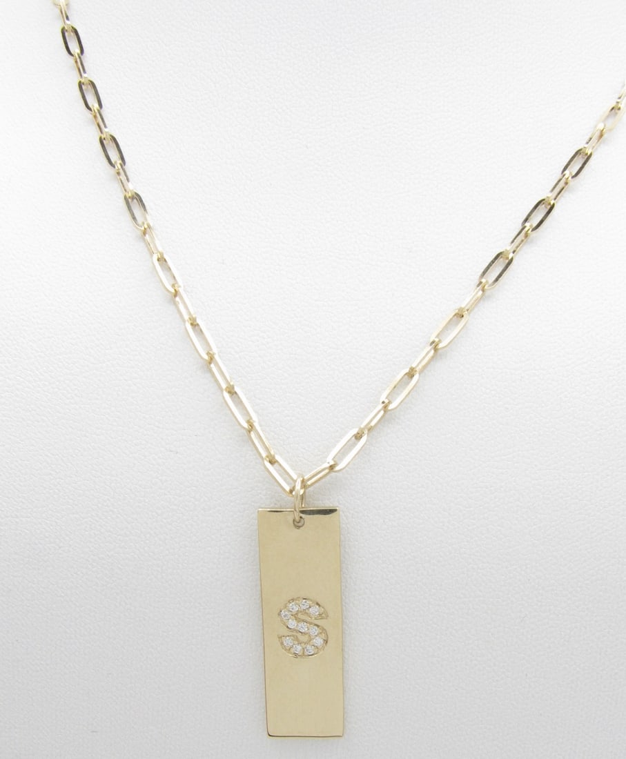 14K Yellow Gold "S" Initial Diamond Pendant, Chain: A 14K yellow gold medallion pendant with pave set diamond "S" in medallion, on a 22" oval link chain. Necklace weight 8.0dwt. Diamond weight .10ctw.