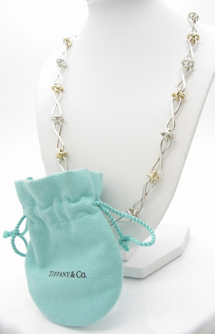 Tiffany & Co Picasso Infinity Link Necklace, 18K: Paloma Picasso designed Tiffany & Co. Infinity Link gold knot necklace in sterling silver with 18K yellow gold knots. 18" long. Lobster claw clasp. With Tiffany blue microfiber drawstring bag. Paloma