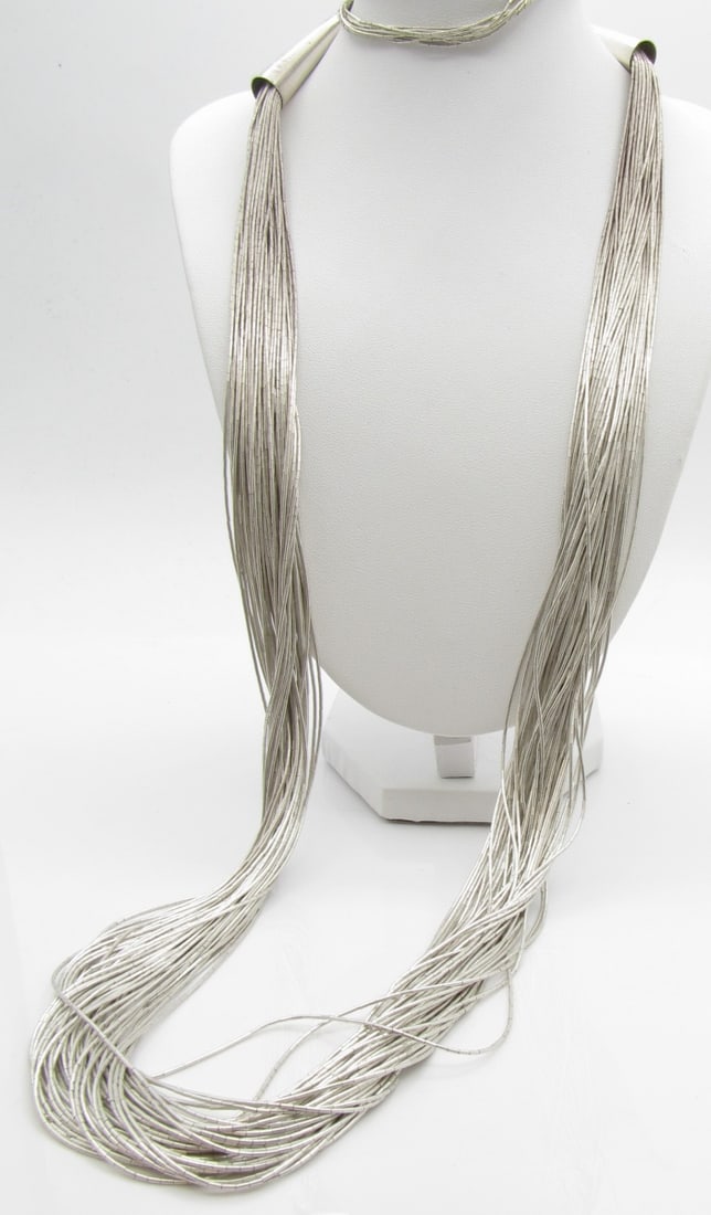 Heavy Liquid Silver Multistrand Necklace, Bracelet: Very nice liquid silver, marked 'sterling', multi-strand necklace, approx 26", with matching 6.5" bracelet, 57.2dwt total