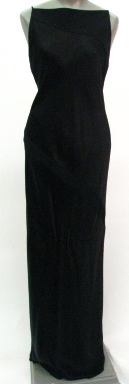 Donna Karan Signature Evening Dress: Donna Karan Signature gold label black "slip" design evening dress with spaghetti style straps. This full length dress has a high neckline and plunging "U" cut back. Dress is pull on and features diag