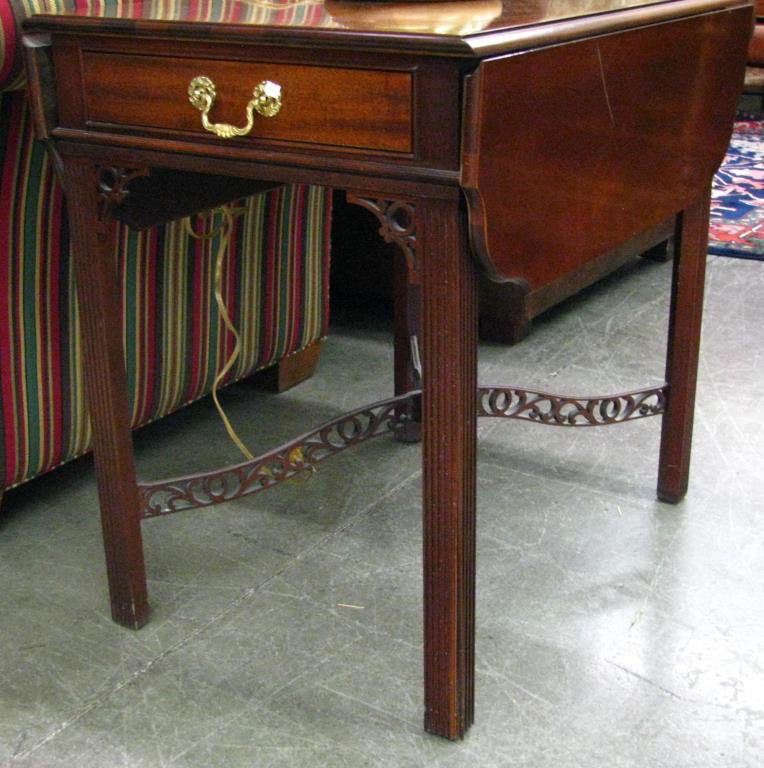 Pair of Councill Period Style End Tables: A pair of Councill period style end tables, reeded legs, reticulated stretcher base, drop leaf tops, one drawer each, evidence of moderate use
