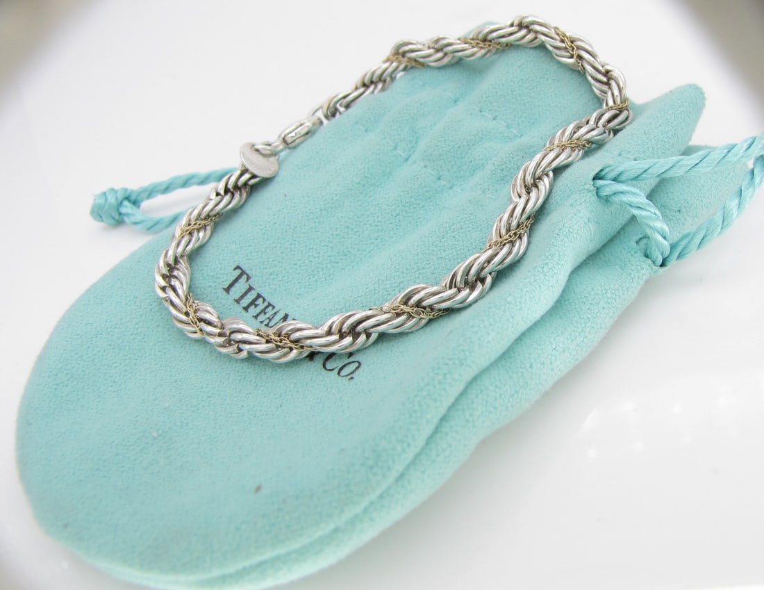 Tiffany & Co. 18K YG, Sterling Rope Bracelet: A Tiffany & Co. 18K yellow gold and sterling silver 7.25" long rope bracelet. 8.4dwt.