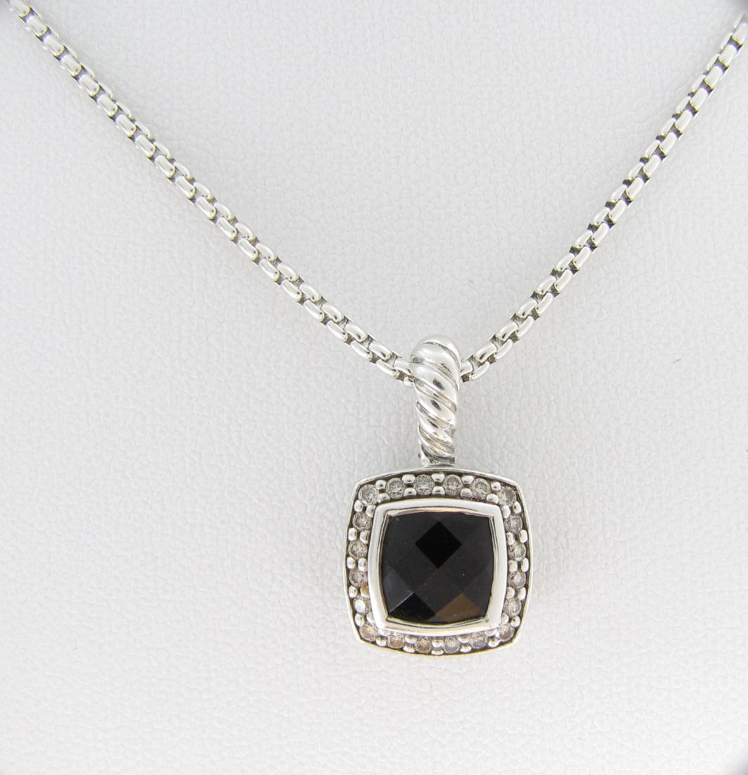 David Yurman Albion Onyx, Diamond Pendant: A David Yurman, sterling silver Albion pendant with cushion shaped onyx stone and diamond, approximately .79" x .47". On 16" long DY sterling box link chain. Lobster claw clasp.