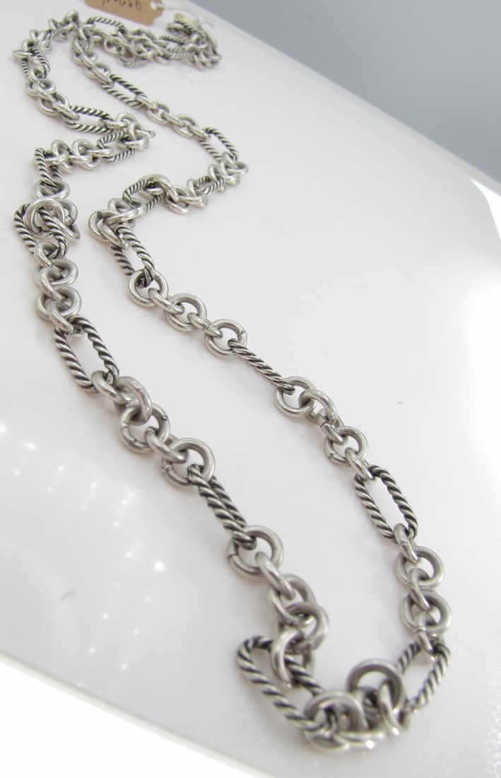 David Yurman Sterling, 18K Figaro Chain, 33.5": A David Yurman 33.5" long sterling silver figaro chain with 18K yellow gold link in toggle clasp.