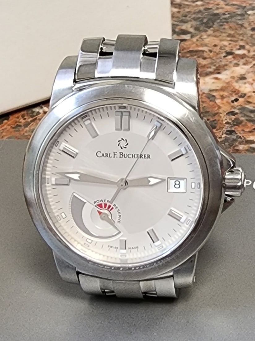 Carl F Bucherer Patravi Automatic Watch: A Carl F Bucherer stainless steel Patravi automatic watch with power reserve, 39mm, brushed steel dial with luminous tipped block markers, luminous tipped sword hands, date at 3 o'clock, polished