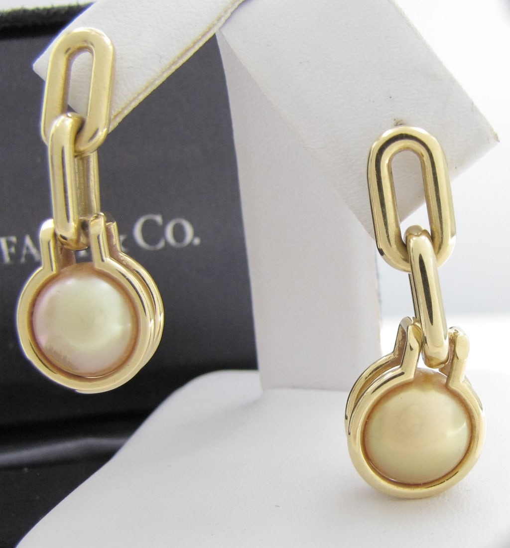 Tiffany & Co. 18K YG Hardwear Pearl Earrings: A pair of Tiffany & Co. 18K yellow gold Hardwear pearl link earrings, each with 9.5mm gold with pearl. Earrings approximately 1.125" long.