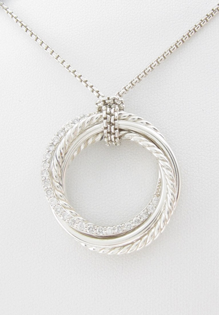 David Yurman Diamond Crossover Pendant Necklace: A David Yurman 26mm crossover pendant necklace with .56ctw of diamonds. On a 36" long chain. Pendant approximately 1.25" diameter. Like new!