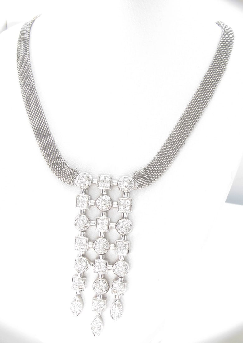 14K White Gold Fancy Diamond Necklace, 1.75CTW: A 14K white gold necklace featuring (121) round, brilliant cut diamonds set in square, round and marquise shaped settings, in drop design, dropping approximately 3", affixed to an 8mm mesh chain.