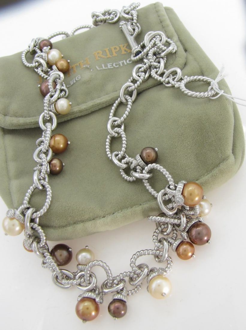 Sterling Silver Judith Ripka Pearl Necklace: A sterling silver necklace by Judith Ripka featuring drop multi-colored cultured pearls on an approximately 19" long chain of oval rope twist links and polished connecting links, with cubic zirconia