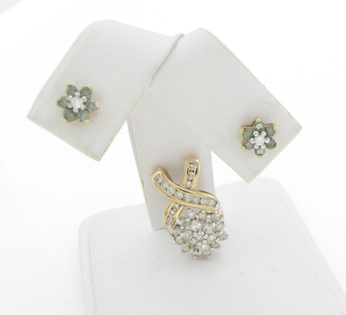 14K YG Stud Peridot, Diamond Earrings, Pendant: A pair of 14K yellow gold stud earrings, each earring featuring six round approximately 1.5mm peridot stones, set in flower pattern around a diamond melee center stone. Earrings measure approximately