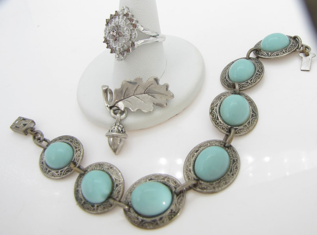 Bracelet, Ring and Pin, and Costume: A 7" long faux turquoise link bracelet; an oak leaf and acorn pin, 1" long; and an unmarked cocktail ring (acid test inconclusive) weighing 2.6dwt, size 7.