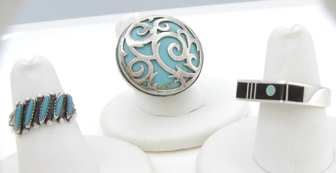 Southwest Style Rings, Veronica Benally: Three sterling silver rings including a ring marked GFJ Thai, with silver scrollwork overlay over a blue enamel or stone, size 8, mount measures approximately 1.125" diameter; a Veronica Benally