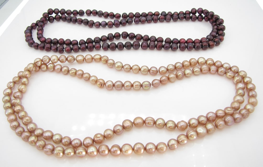 Two Dyed Pearl Opera Length Necklaces: Two dyed pearl strands including burgundy dyed baroque pearl strand measuring approximately 35"; and a peach dyed cultured freshwater baroque pearl strand, also measuring approximately 35".