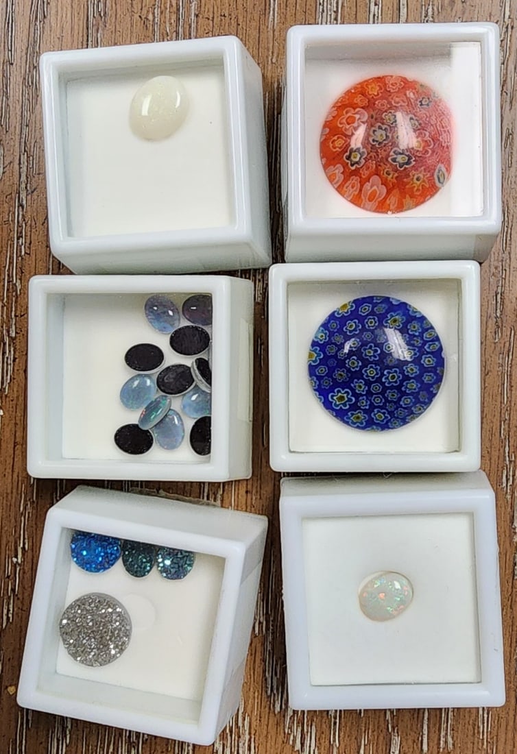 Group of Gemstones, Druse, Opal, Murano: A group of loose gemstones including two 25mm Murano glass cabochon stones; two Australian white opals, 12x10mm and 10x8mm; Four druse stones, likely titanium treated and on a chalcedony base, 14mm