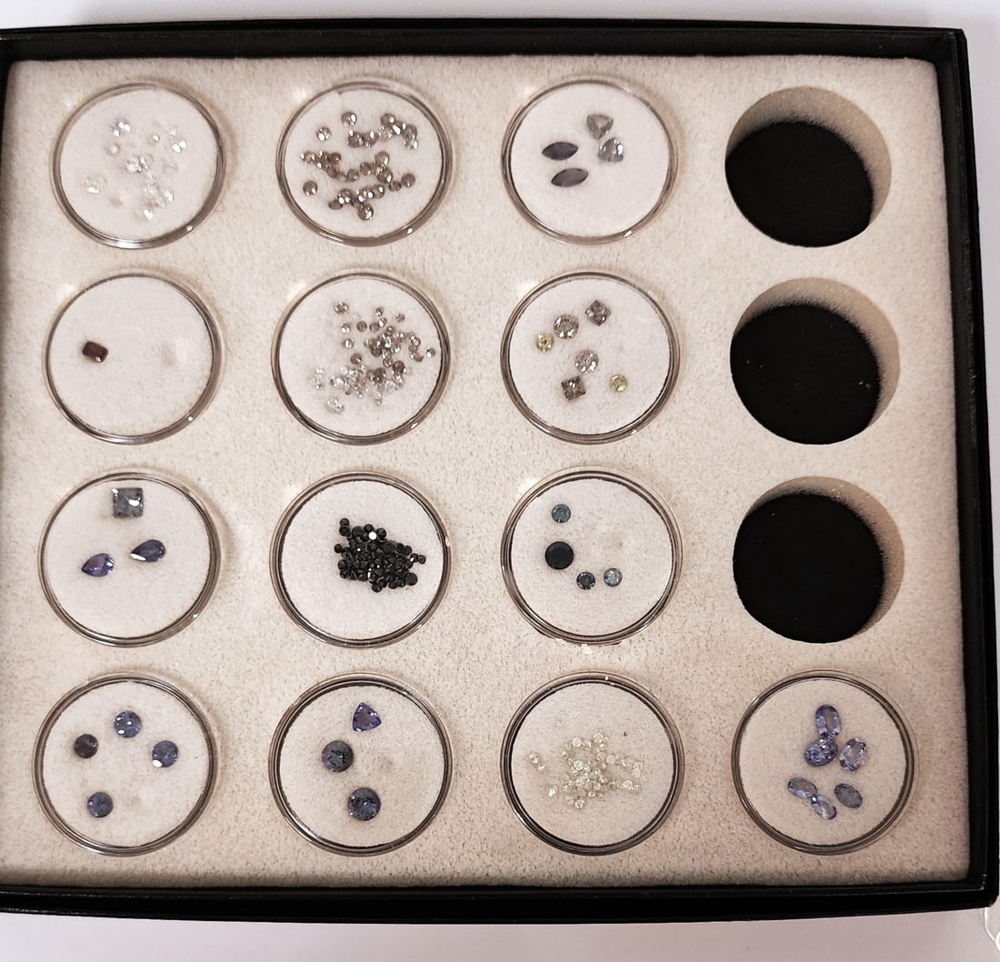 Tray of Loose Gemstones: A tray of loose gemstones, includes thirteen "rounds" of unidentified or misidentified stones in an assortment of colors, sizes and shapes. This assortment comes to us from the same estate as all of