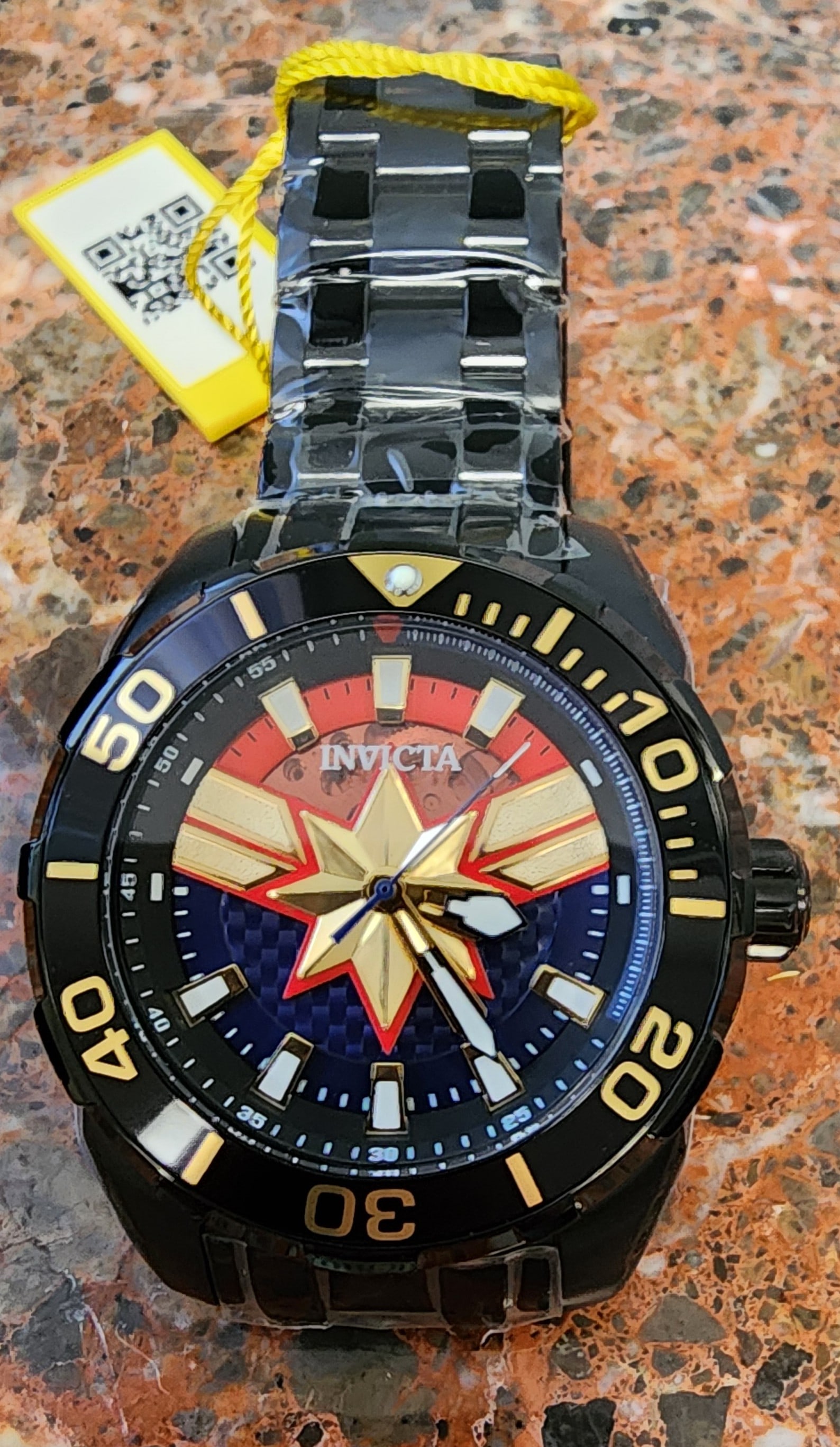 Invicta Marvel Captain Limited Edition Watch: An Invicta Marvel Captain Mavel Limited Edition watch, model 43057, automatic movement, 50mm stainless steel case, black ion-plated case, matching stainless bracelet, partial exhibition Captain