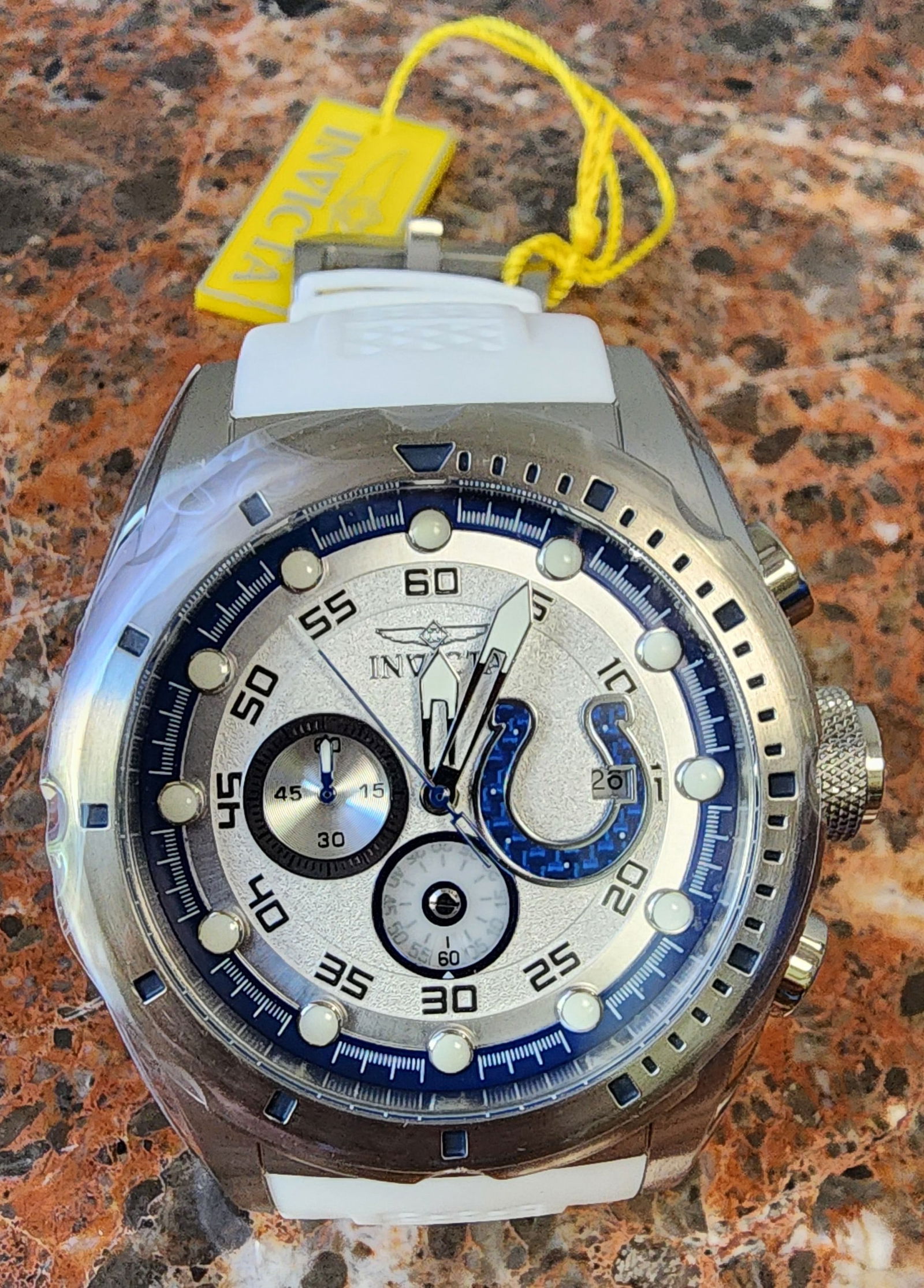 Invicta NFL Indianapolis Colts Watch: Invicta NFL Indianapolis Colts Watch, model 45545, 50mm stainless steel case, quartz movement, white silicone band, subdials at 6 and 9 o'clock, date and colts logo at 3 o'clock, luminous dot markers