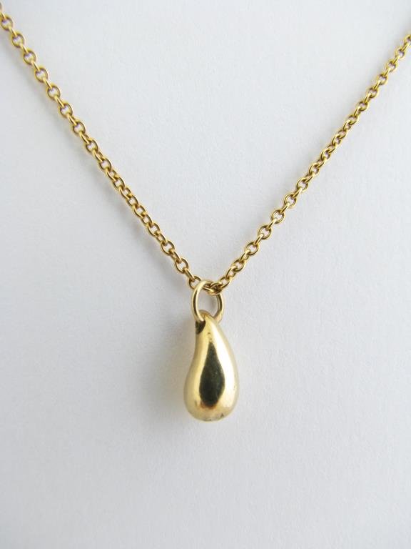 18K YG Tiffany & Co Peretti Tear Drop Pendant: 18K yellow gold Tiffany and Co. Elsa Peretti tear drop pendant on chain, retail $995 69150