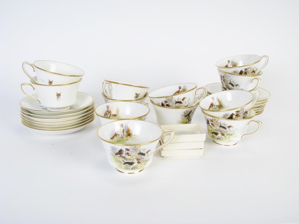 Royal Worcester "Fox Hunt" Tea Service: A Royal Worcester "Fox Hunt" tea service, signed T. Ivester Lloyd, includes twelve teacups, thirteen saucers, and a sugar bowl, also includes three Royal Doulton sugar holders