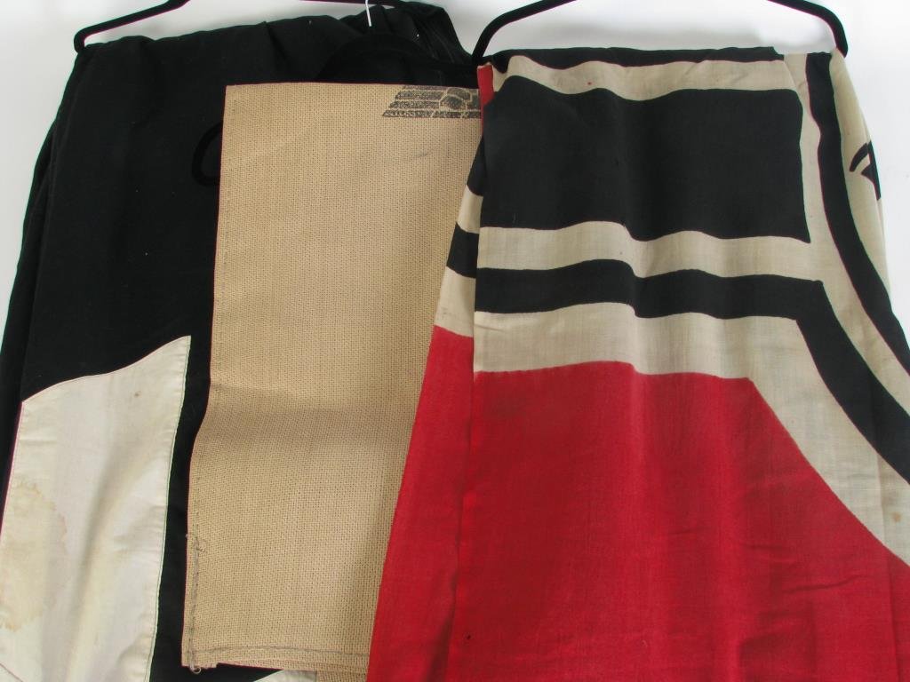 Nazi SS Banner and Flag, Nazi Duffle: A Third Reich SS cotton banner, approximately 14' x 3.5', in good condition; a Nazi flag with iron cross, approximately 3' x 6', printed on edge "Reichskriegsflg.", repair and some holes; and a canvas