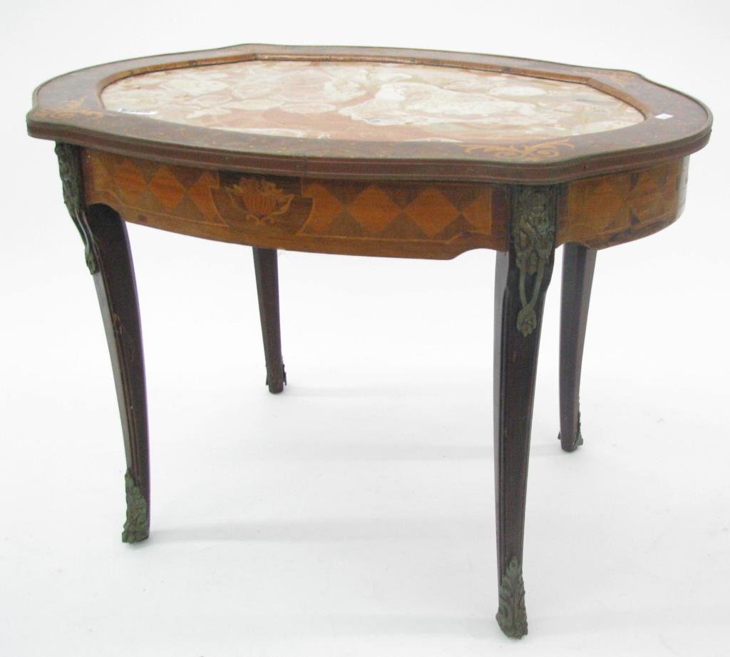 Vintage French Inlaid Table: A vintage French inlaid table with marble top insert, scroll and leaf motif marquetry inlay, bronzed ormolu and banding, 20" high, 29" x 20" oval, ormolu is tarnished