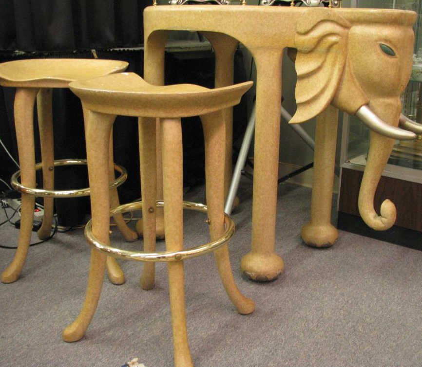 Elephant Glass Top Bar and Stools: Elephant bar with smoked glass top, brass gallery, light signs of use, with two matching stools