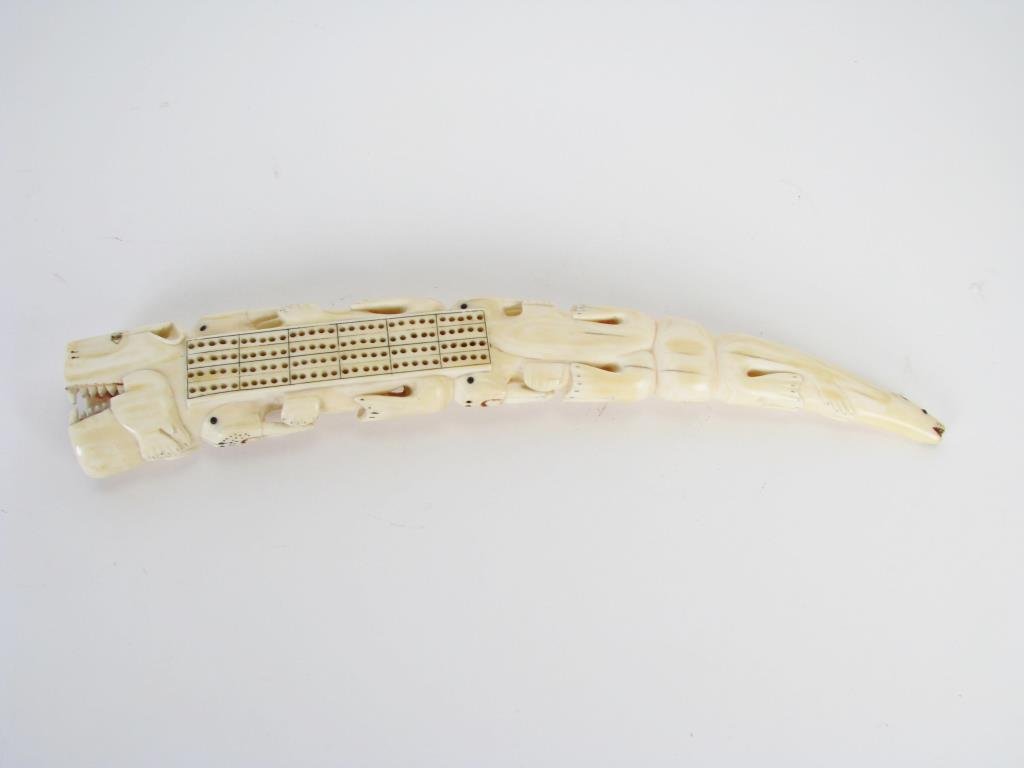 Ivory Tusk Cribbage Board: An ivory tusk cribbage board, 13" long, 2.125" wide and approximately 1.125" deep