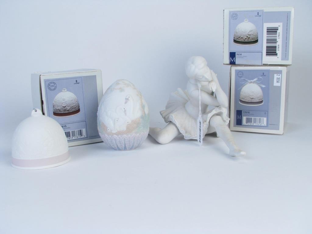 Group of Lladro Porcelain: Group of Lladro porcelain including ballerina figure and four seasonal bells with boxes and egg with doves"