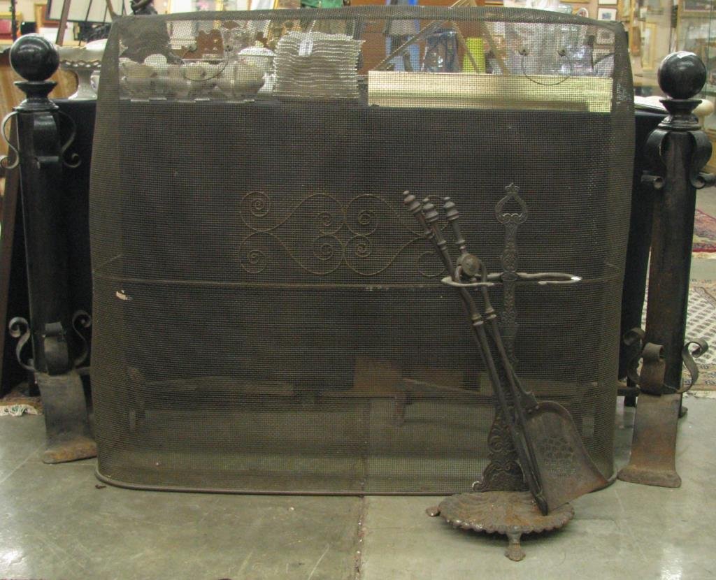 Antique Fireplace Accessories: Antique fireplace accessories including woven mesh screen, pair of 35"" high cannonball andirons, and four-piece fireplace tool set"