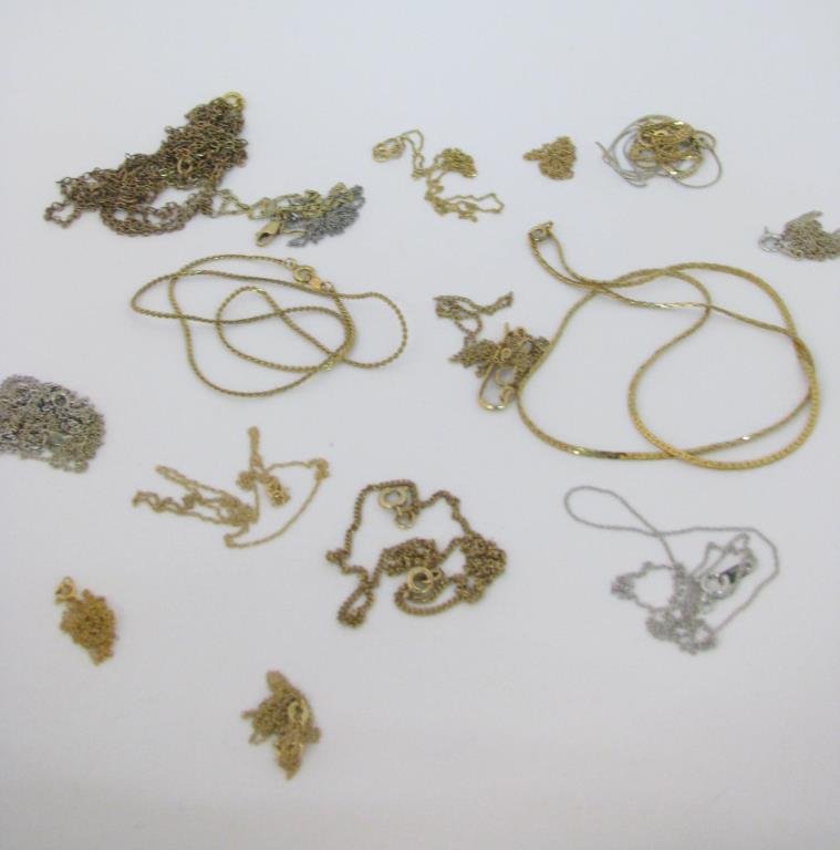Large Group of Gold Chains: A large group of gold chains including 14K gold chains including two white; eight gold (some broken), 7.7dwt; 10K white gold chain and 10K yellow gold chain, .7dwt, and six unmarked/gold filled/other