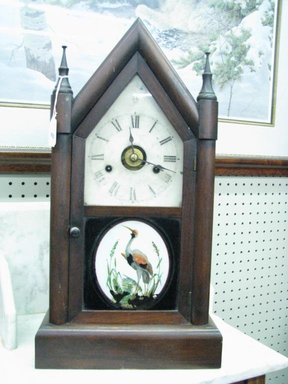 Seth Thomas Mantle Clock: A Seth Thomas Mantle Clock, gothic arch style case, with reverse painting on glass door, 21" high