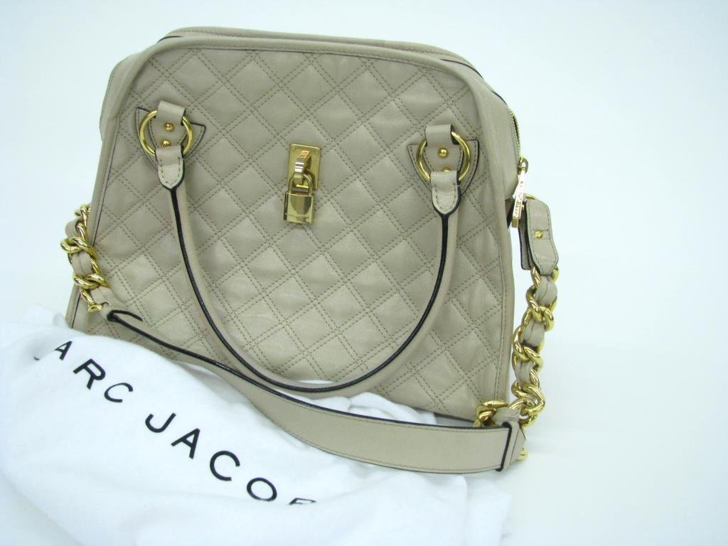 Marc Jacobs Classic Quilted Bag, Ivory Leather: Marc Jacobs "Classic" quilted bag in in ivory tone leather. Bag has two top handles and chain link design shoulder strap. Gold tone hardware with zip top closure. Interior has zipper pocket and slide 