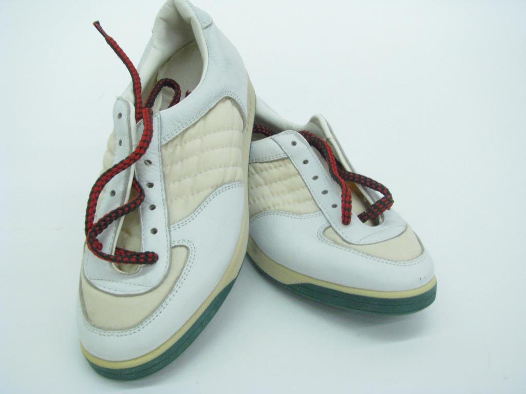 Gucci White Leather/Canvas Tennis Shoes: Pair of vintage Gucci white leather and canvas tennis shoes with green soles and iconic green and red laces. Size 37. Never worn, in original vintage box. Purchases at Gucci 5th Avenue NY Nov. 29, 198