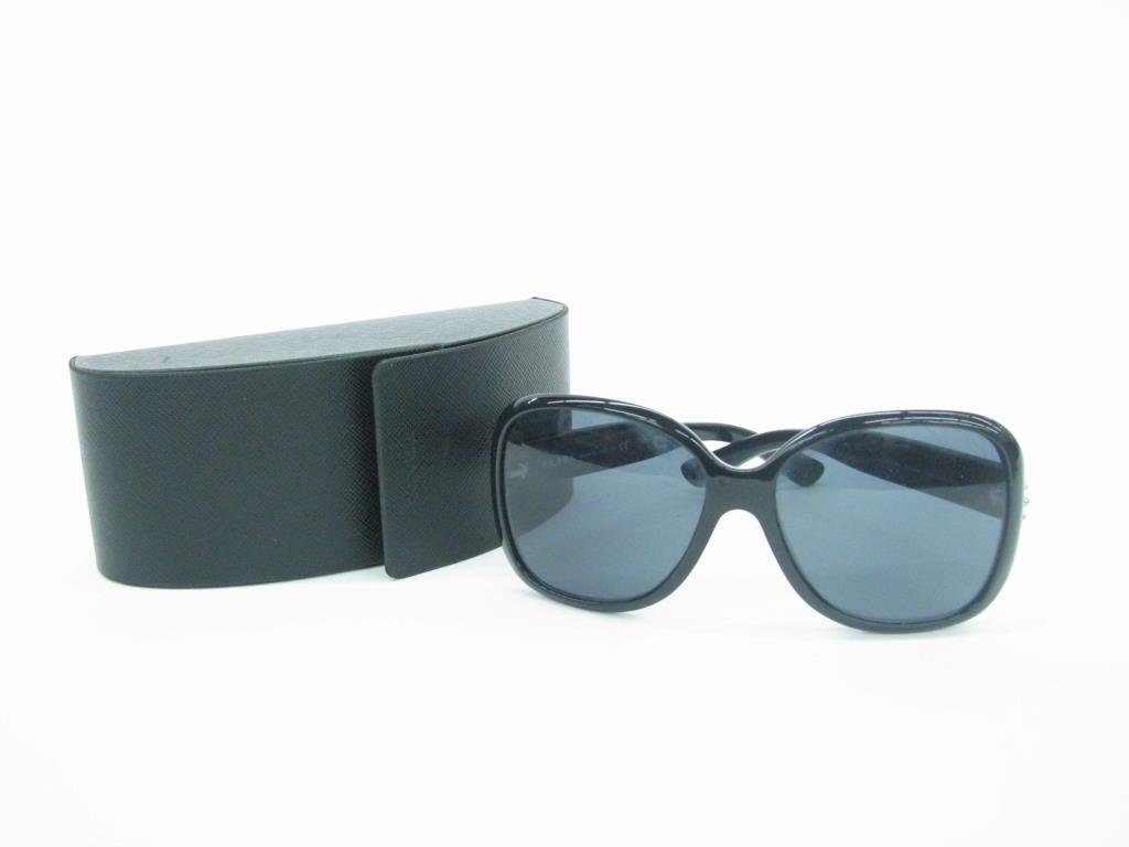 Prada Black Sunglasses: Prada black sunglasses with silver stud detail. They are oversized design with silver tone studs on the arms in original Prada case. Style SPR04M. Retail $350