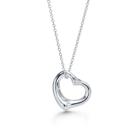 Tiffany Sterling Peretti Diamond Heart Pendant: Tiffany & Co. Elsa Peretti sterling open heart diamond pendant. Pendant is set with two diamonds; one on front, one on back. Pendant is on Tiffany & Co. sterling 16" chain with spring ring clasp. Hear