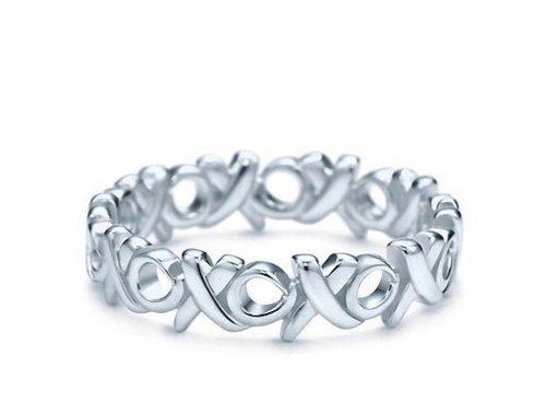Tiffany Sterling Picasso "Love & Kisses" Ring: Tiffany & Co. Paloma Picasso "Love & Kisses" sterling silver band ring. Band is 4 mm wide. Stamped T & Co. 925 with Paloma Picasso signature. Size 7.