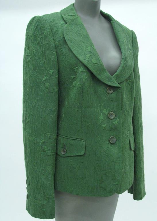 Armani Brocade Blazer: Armani Collezioni green brocade textured three button blazer. Brocade is floral design, jacket has rounded lapels and two front button flap pockets. Fully lines. Made in Italy. Size 12