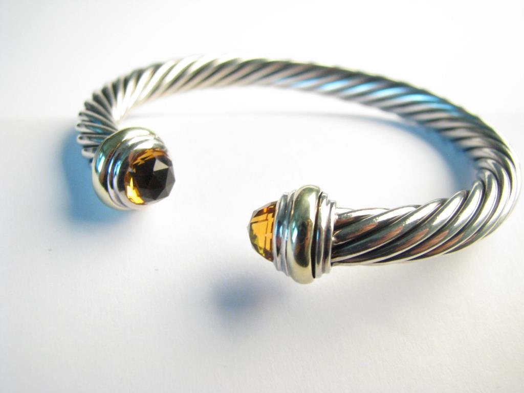 David Yurman 14K, Sterling Cuff Bracelet, Citrine: A David Yurman 14K yellow gold and sterling 7mm cuff bracelet with faceted citrine stones, 2.25" x 2" inside measurement