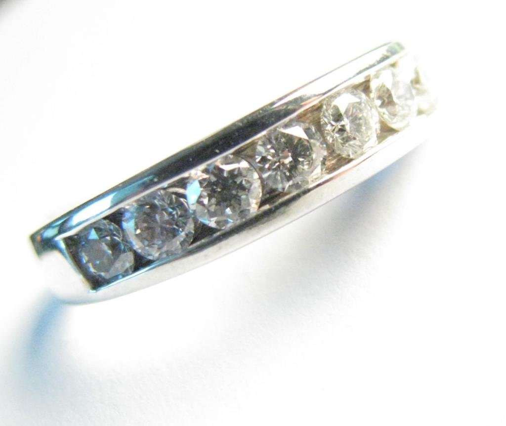 14K White Gold Diamond Anniversary/Stack Band: A 14K white gold anniversary or stack band containing eight diamonds weighing 1ct plus, of SI clarity and H-I color, 3.6dwt, size 8