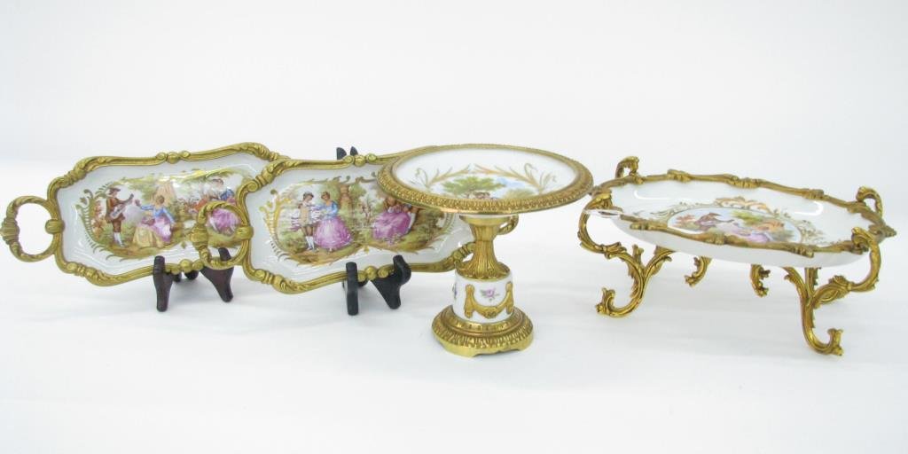 Group of Decorative French Porcelain: A group of decorative French porcelain, all with gilt metal frames, all with hand painted romantic couple depictions, including 10" x 7" raised oval bowl; two 11" handled relish trays; and one 5.5" pe