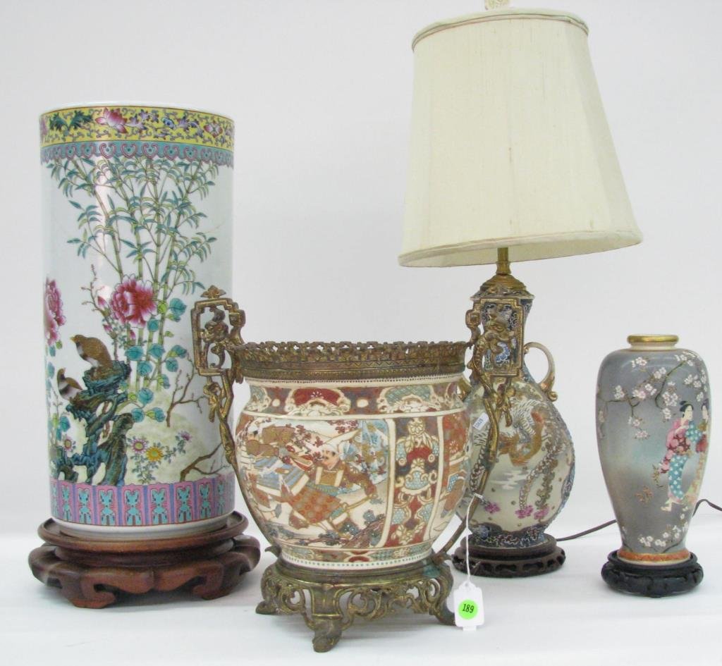 Group of Decorated Oriental Porcelain: A group of decorated Oriental porcelain including 18" vase with bird and floral motif and wooden stand (hairline cracks); an earthenware planter with brass frame (nice, antique piece, loose handles, i