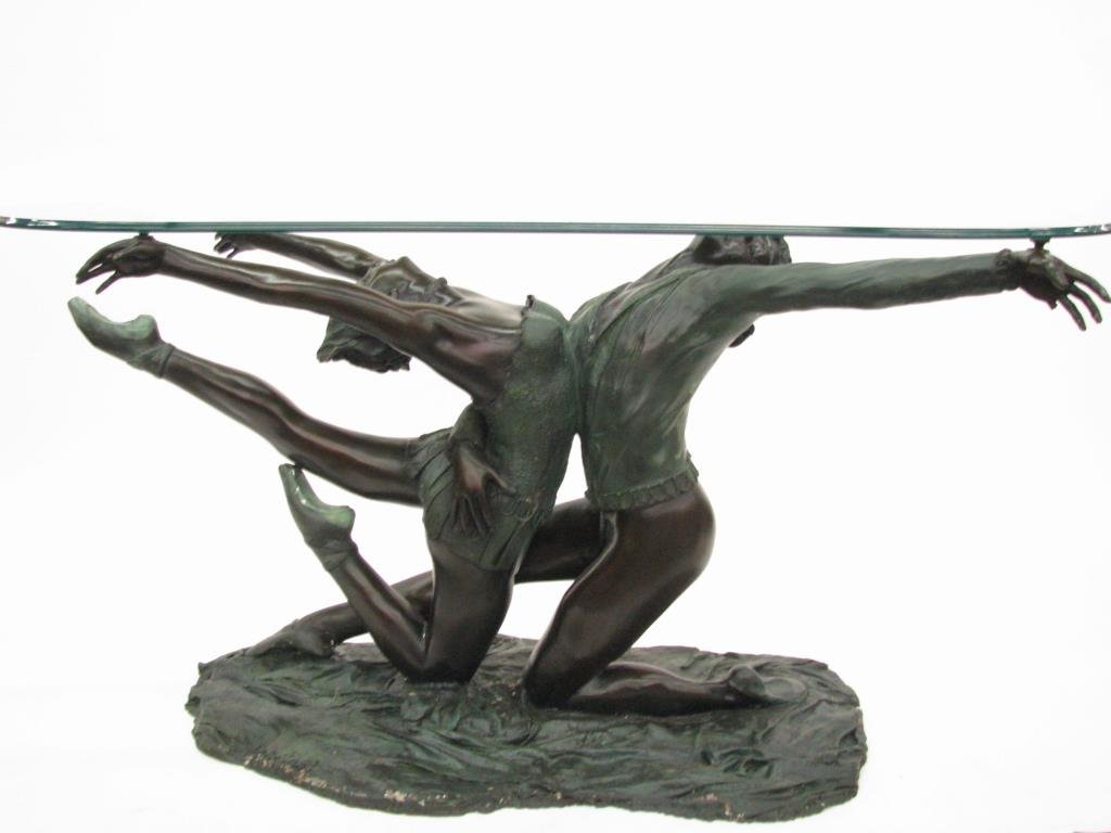 Figural Classic Style Console Table: A figural, classic style, console table, base of patinated cast metal depicting ballet dance couple, with oval beveled glass top, manufactured circa 1980's, 31" high x 60" x 30"