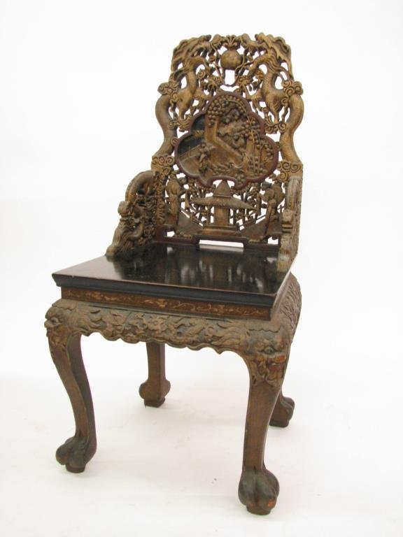 Ornately Carved Oriental Dragon Chair: Ornately carved and decorated Oriental chair, depicting dragons and figures and family in recessed carved back, paint decorated finish, 38.5" high