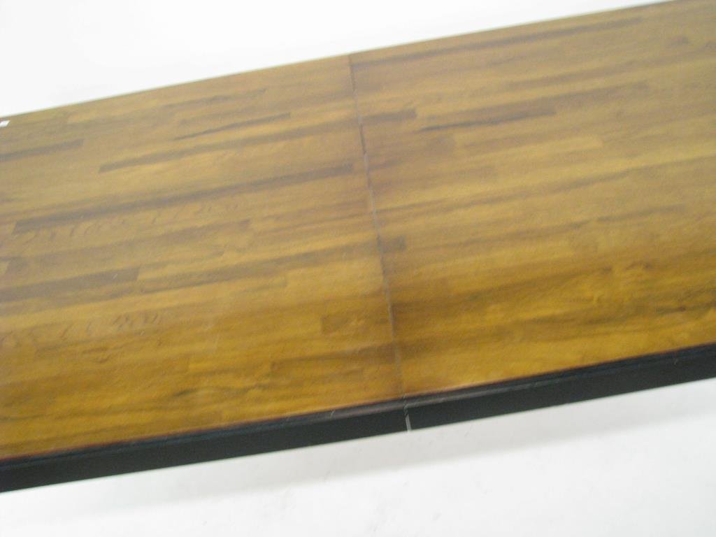 Contemporary Style Dining Table: A contemporary style dining table with black painted apron and legs and natural dark wood finish slatted style top, includes two leaves