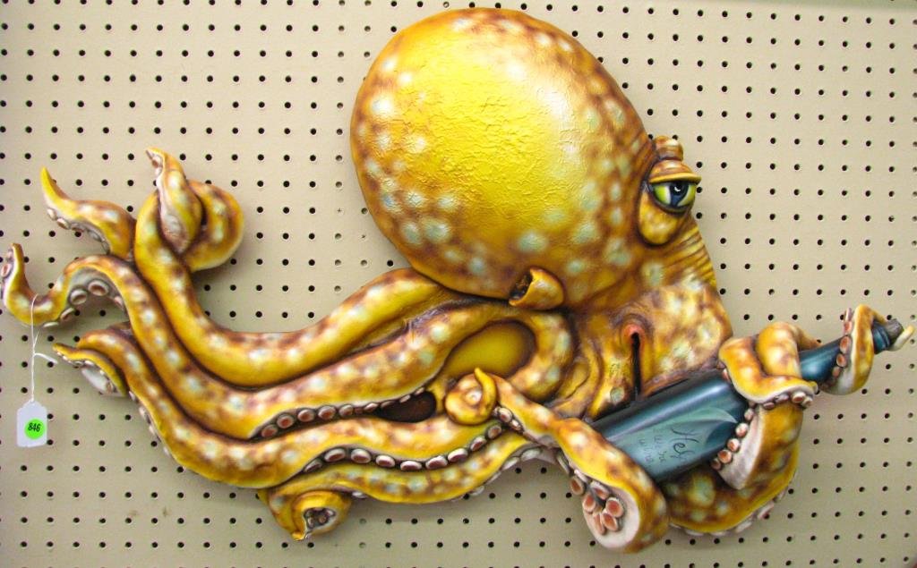 Todd Warner Sea Life Sculpture, Octopus: Todd Warner sea life sculpture, wall hanging octopus with wine bottle, approximately 22" high x 34" long, with C of A