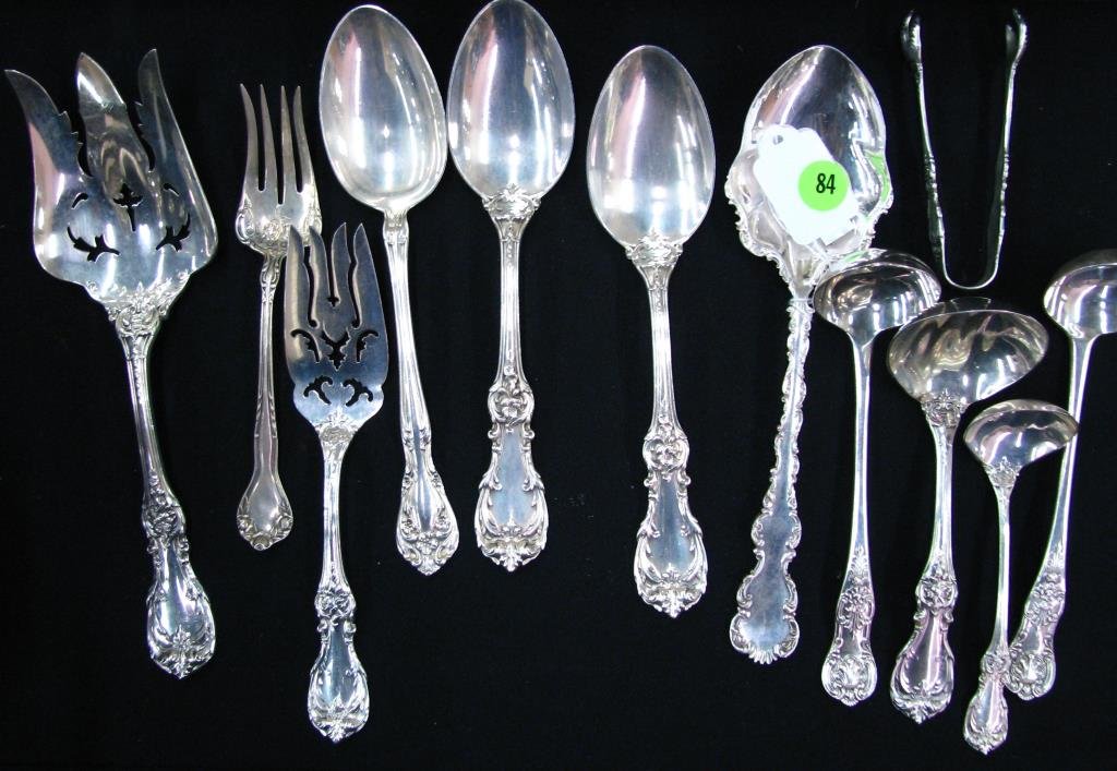 Group of Sterling Silver Tableware: A group of sterling silver tableware including three meat forks, four vegetable spoons, four ladles, and a pair of relish tongs, various patterns, 26.71ozt