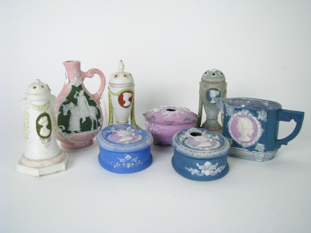 Group of Tri Color Wedgwood and Jasperware: A group of three color Wedgwood and Jasperware including two hair receivers; three shakers; lidded dresser box; cruet; and cream pitcher; some items marked