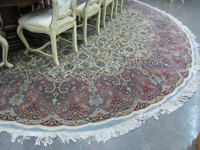 Room Size, Round Oriental Rug: A room size, round, Oriental rug, 13' diameter, fine weave, cream field with plum border and navy, gold and green, scalloped edge shows visible warp