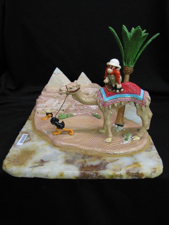 Ron Lee WB Sculpture Featuring Daffy, Yosemite Sam: Ron Lee sculpture Warner Brothers featuring Daffy and Yosemite Sam in desert, with alabaster base and painted cast metal figures, personalized and signed, copyright 2000, Artist Proof 2/50, 12.5" x 16