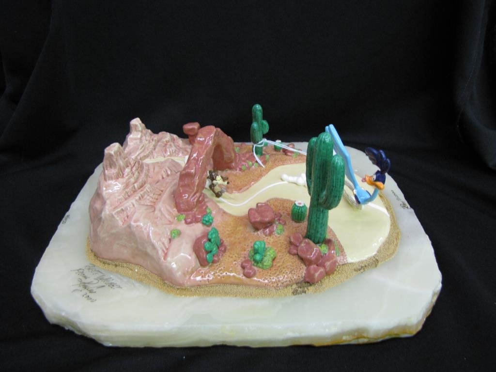 Ron Lee Warner Bros Road Runner Sculpture: Ron Lee Warner Brothers sculpture depicting Road Runner and Wile E. Coyote in the Desert, with alabaster base and painted cast metal figures, edition 9 of 950, signed, copyright 2000, 12" x 10" x 4.5"